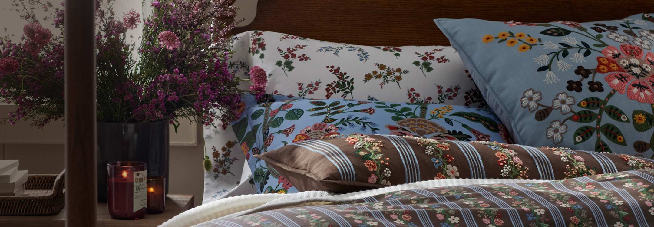 Rifle Paper Co. floral bedding styled in a bedroom