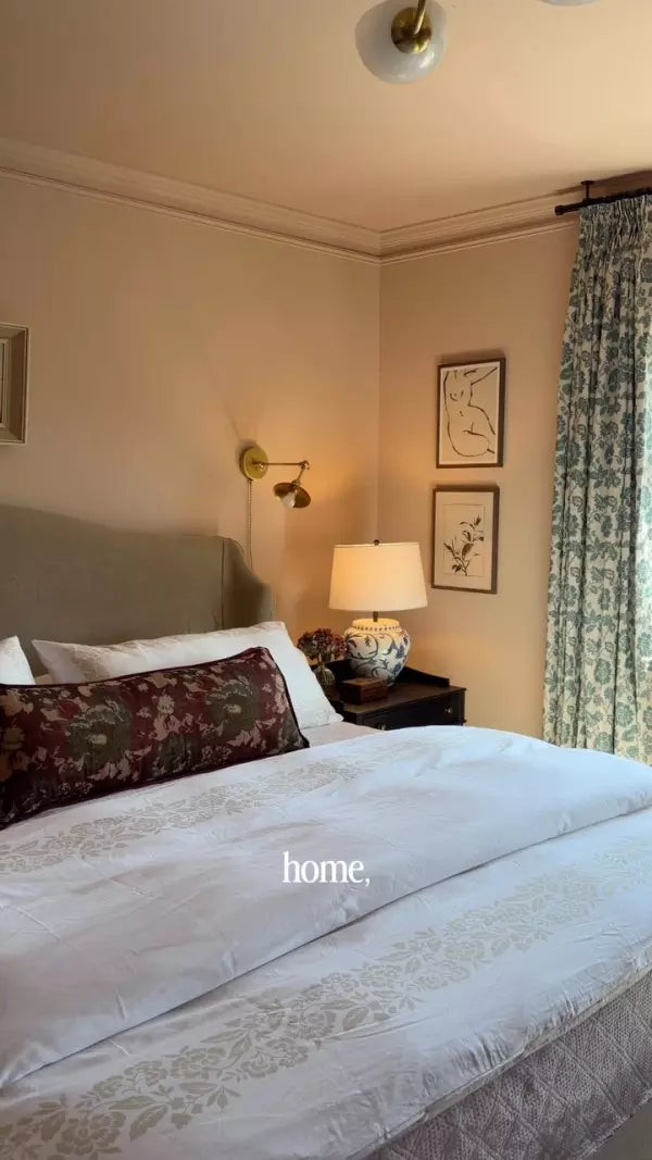 A softly styled guest bedroom with patterned bedding